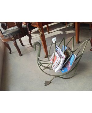 Painted metal log holder in the shape of a swan