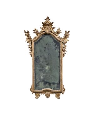 Carved and gilded wooden mirror. Northern Italy, 18th century.