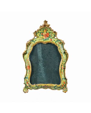 Carved, lacquered and painted wooden mirror. Venice, 18th century.