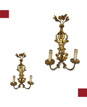 COPPIA DI APPLIQUES IN LEGNO INTAGLIATO E DORATO, META' DEL XIX SECOLO