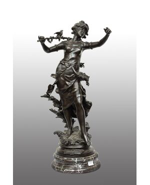 Antique patinated bronze sculpture depicting the "Nimphe de bois" signed "Louis Moreau" resting on a red Levanto marble base. France 19th century.
