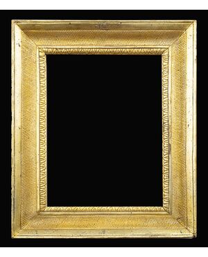 Antique Neapolitan Empire frame in gilded and carved wood, dating back to the first decade of the 19th century.