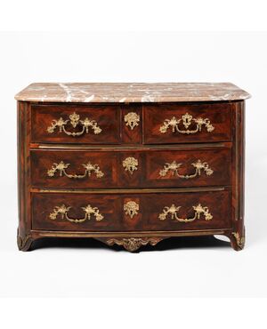 Louis XIV chest of drawers in rosewood, with chased and gilded bronze applications. Red marble top. France, early 18th century.