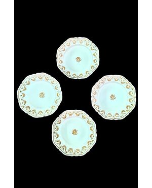 Four majolica plates decorated with festoons and floral motifs. Moustiers, France. Signature Jean Etienne Baron. Olerys and Laugier manufactory.