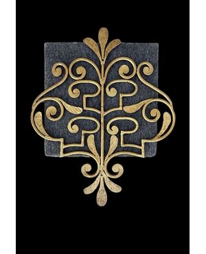 Wrought iron and gilded coat rack wall light.