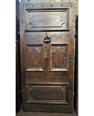 PTCI474 - Studded small door, with sculpted panels, in walnut wood, 18th century, measurements cm W 114 x H 238