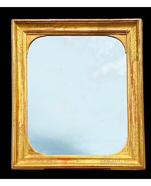 Carved wooden mirror-frame.