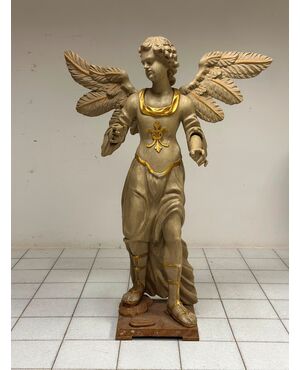 Winged angel in carved and gilded wood. Siena, 18th century. H 136 cm
