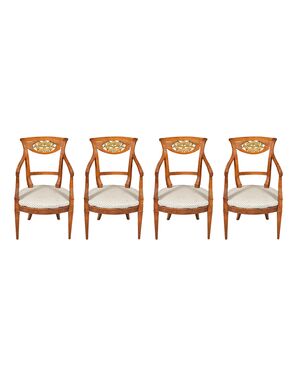Four carved wooden armchairs. Italy, mid-19th century.