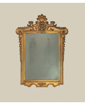 Carved and gilded wooden mirror, 19th century