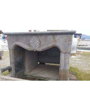 18th-century style stone fireplace