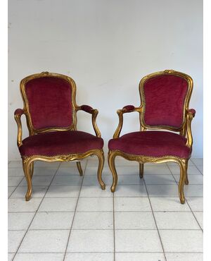 Pair of carved and gilded wooden armchairs. Lombardy, 19th century