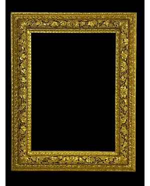 Venetian mirror in finely carved and gilded wood, early 19th century.