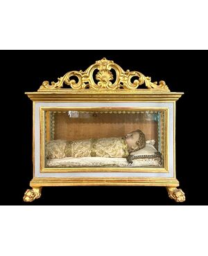 Scultura in cera Gesu’bambino entro teca.