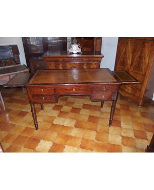 Flame mahogany center desk, mid-19th century Empire style, cm L129xP67xH80