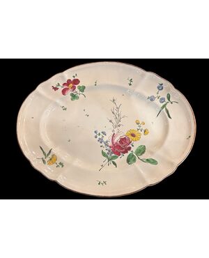 Oval majolica plate decorated with a 'rose' design. Finck Manufacture. Bologna.