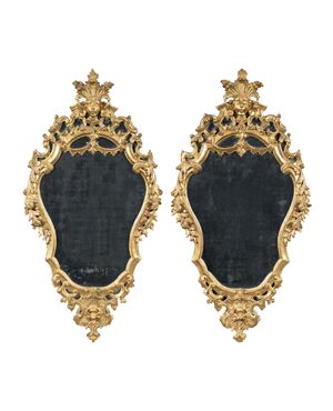 Pair of carved and gilded wooden mirrors. Italy, 18th century.
