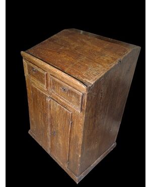 Small writing desk painted to look like wood.