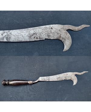 Refined wrought iron and engraved winegrower's tool.