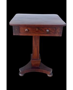 Walnut table with central leg and three-foot base. Empire period.