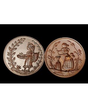 Two round butter stamps with handle, 19th century