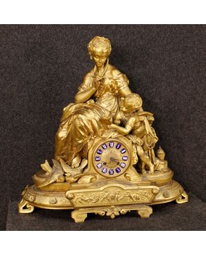 French clock in golden antimony