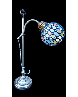 Lamp with metal stem and globular part with leaded glass.