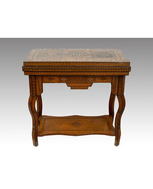 Antique game table in polychrome woods with mother-of-pearl inlays. Syria 19th century.