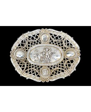 Pierced silver centerpiece with putti and figures. Holland.