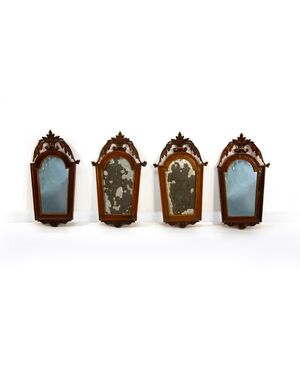 Four walnut and gilded wood wall sconces, early 19th century