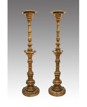 Pair of antique Florentine torcieri (torch holders) in gilded and carved wood, from the first half of the 19th century.