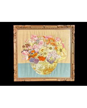 Framed panel with vase of flowers embroidered on fabric.