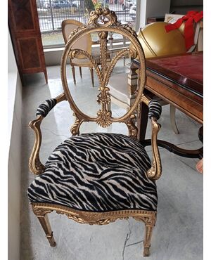 Gilded wood armchair with carved crest