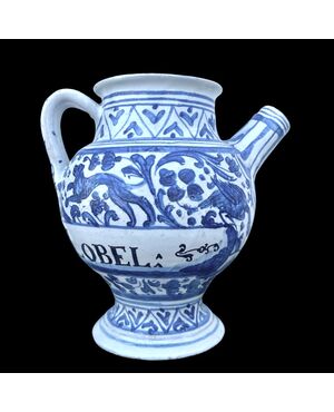 Majolica pouring vessel with turquoise decoration, calligraphic motifs, animal and plant subjects, and the date 1735. Ferniani manufacture, Faenza.