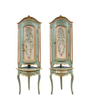 Pair of carved, lacquered and painted wooden corner cabinets. Piedmont, 18th century.
