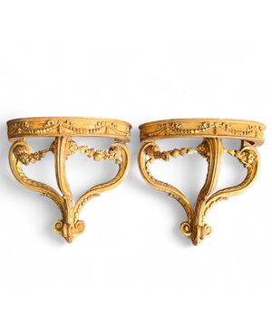 Pair of drop-shaped consoles