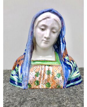 Majolica bust of Madonna with floral decoration in art nouveau style, made by Angelo Minghetti, Bologna.     