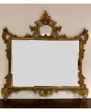 Mirror in carved and gilded wood. Early 20th century     