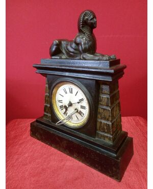 Pendulum clock with sphinx