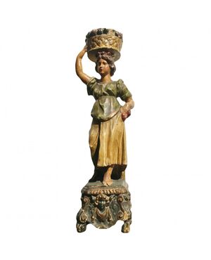 Polychrome wood sculpture depicting a female figure     