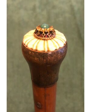 Stick with horn and ivory knob with hard stone.     