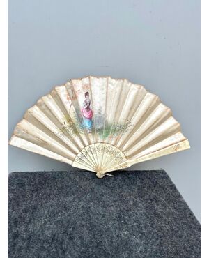 Fan with bunting in silk painted with a female figure. Slats in pierced ivory. France.     