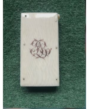 Ivory matchbox with engraved initials.     