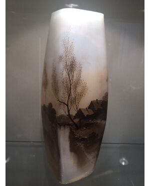 Early 20th century vase painted with river landscape.     