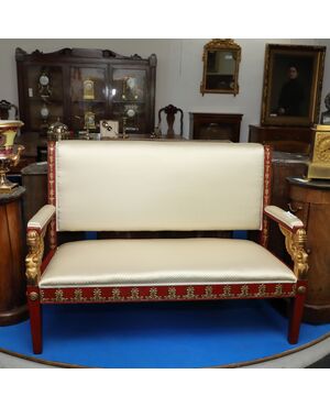 Sofa in Pompeian red and gilded lacquered wood     