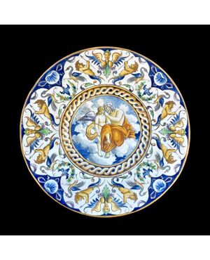 Majolica plate with Raphaelesque decorated brim and central medallion with mythological scene.Manifattura Di Giuseppe Battaglia.Naples.     