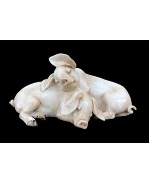 Pair of pigs in polychrome porcelain. Tay manufacture by Giuseppe Tagliariol. Monza     