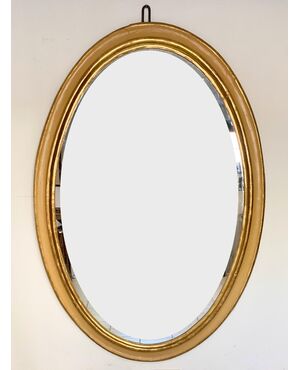 Grande specchiera ovale in lacca e oro . Marche XVIII secolo
