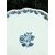 Piatto-tagliere in maiolica con quattro piedini a ‘pigna’,tesa polilobata con motivi rocaille e decoro floreale in monocromia turchina.Doccia,Ginori.