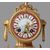 Trittico composto da orologio e due vasi in porcellana di Sevres del 1800